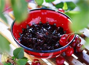 Cherry jam in red bowl