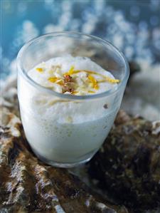 Frothy oyster soup in a glass