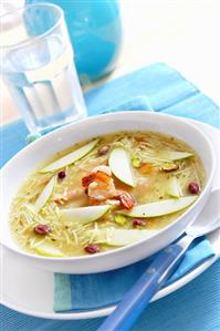 Noodle soup with apples, prawns and pistachios