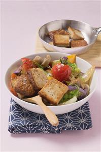 Smoked tofu with roasted vegetables in oil and lemon