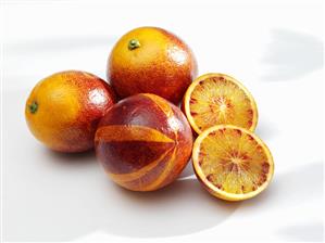 Blood oranges, whole and halved