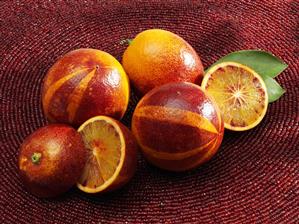 Blood oranges, whole and halved