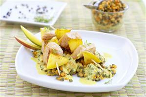 Turkey and mango skewers on lentil salad