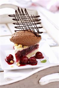 Piece of cherry cake with chocolate mousse