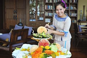 Thai woman with carved fruit