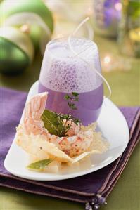 Red cabbage foam soup with Parmesan wafer and langoustines