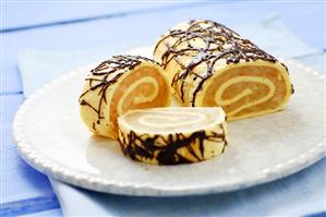 Sponge roulade with apple filling and chocolate decoration