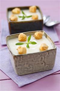 Cream of asparagus soup with tarragon and choux pastry balls