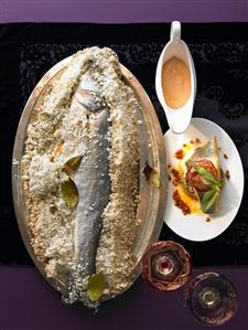 Sea bass in salt crust with bay leaves & blood orange hollandaise