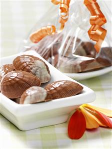 Chocolate shells with orange and cardamom filling