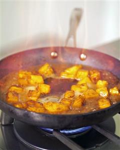 Flambéing pineapple chunks