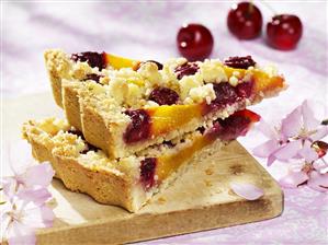 Peach and cherry crumble tart