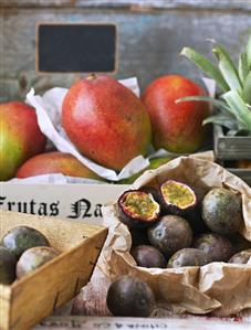 Mangos and passion fruit on a market stall