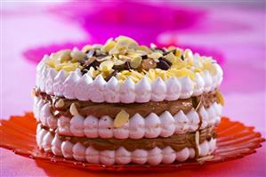 Meringue cake with chocolate filling and almonds
