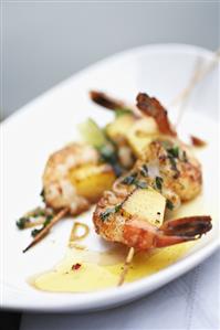 Scampi and pineapple skewers with ramsons (wild garlic)