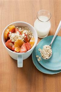 Muesli with red berries in a cup