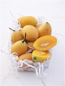 Thai mangos in a plastic container