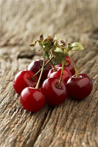 Morello cherries on wooden background