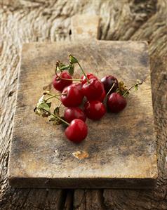 Morello cherries on old chopping board