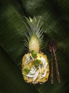 Bacalao pina colada (Cod with coconut sauce in pineapple half)