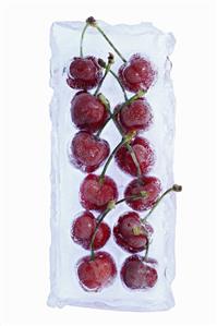 Cherries frozen in a block of ice