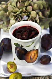 Plum compote in a beaker