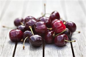 Cherries on wooden table