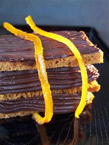 Stacked slices of bread with chocolate spread & candied orange peel