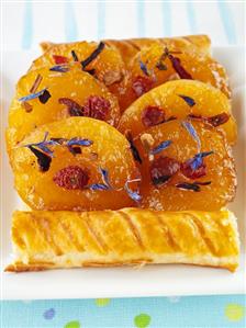 Apricot puff pastry tart with dried flowers