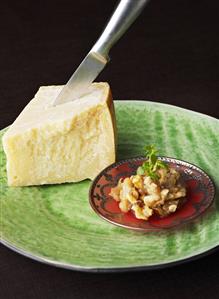 Apple and walnut chutney and a piece of Parmesan with knife