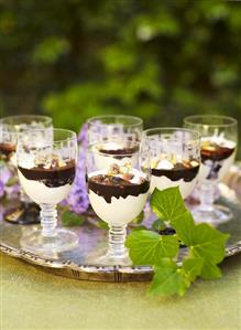 Glasses of chocolate coconut mousse with rum & pistachios