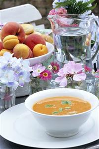 Tomato soup on laid table