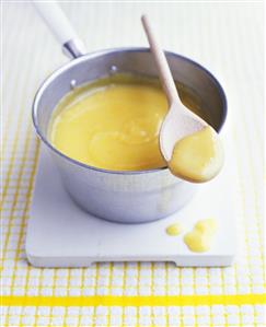 Lemon curd (lemon spread, UK) in a saucepan