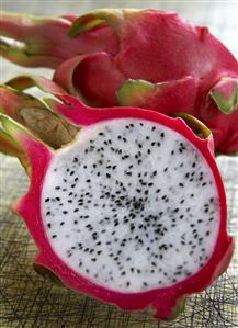 Half a pitahaya and whole pitahaya (close-up)