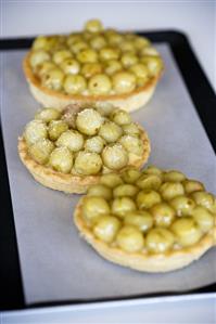 Three gooseberry tarts