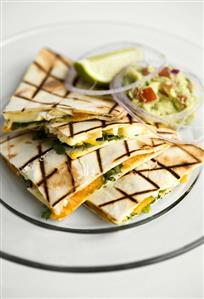 Quesadillas with mango and Brie filling, with guacamole