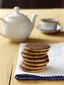 Chocolate biscuits, tea in the background