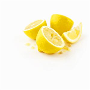 Lemon halves and a wedge of lemon