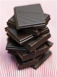 Pieces of organic dark chocolate, stacked