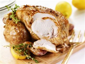 Lemon chicken with thyme, partly carved