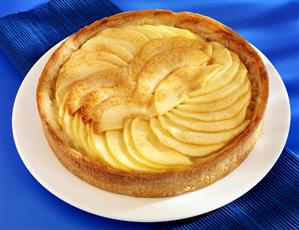 An apple tart on a cake plate