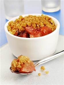 Pear and plum dessert with crunchy muesli topping