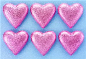 Six chocolate hearts in pink foil