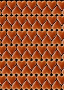 Chocolate hearts arranged in rows, black background