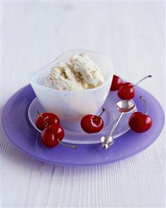 Turron ice cream in a glass bowl with cherries