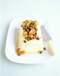 Lemon curd ice cream parfait with dried apricots, pistachios