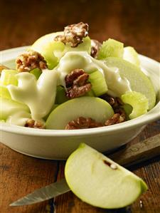Waldorf salad on rustic wooden table