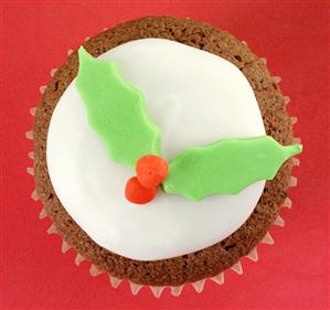 Chocolate cupcake with holly leaf decoration