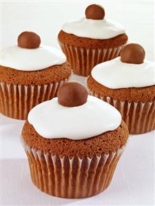 Four iced chocolate cupcakes