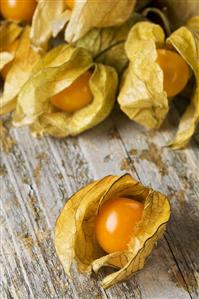 Cape gooseberries on wooden background